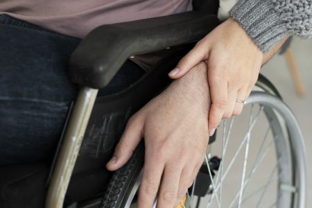 Woman helping out a person with a disease