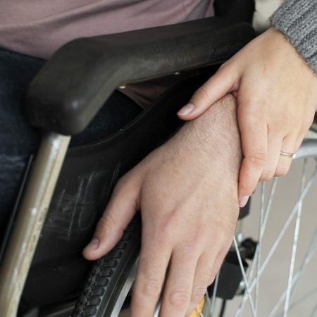 Woman helping out a person with a disease