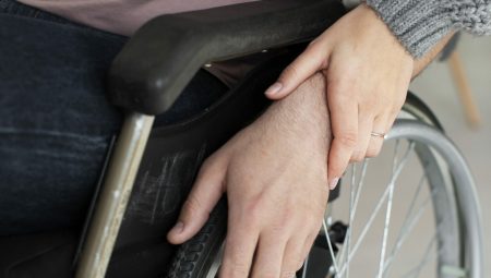 Woman helping out a person with a disease